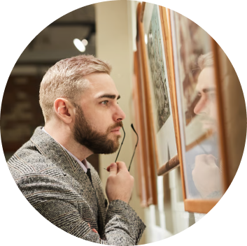 Visitor observing art in a museum