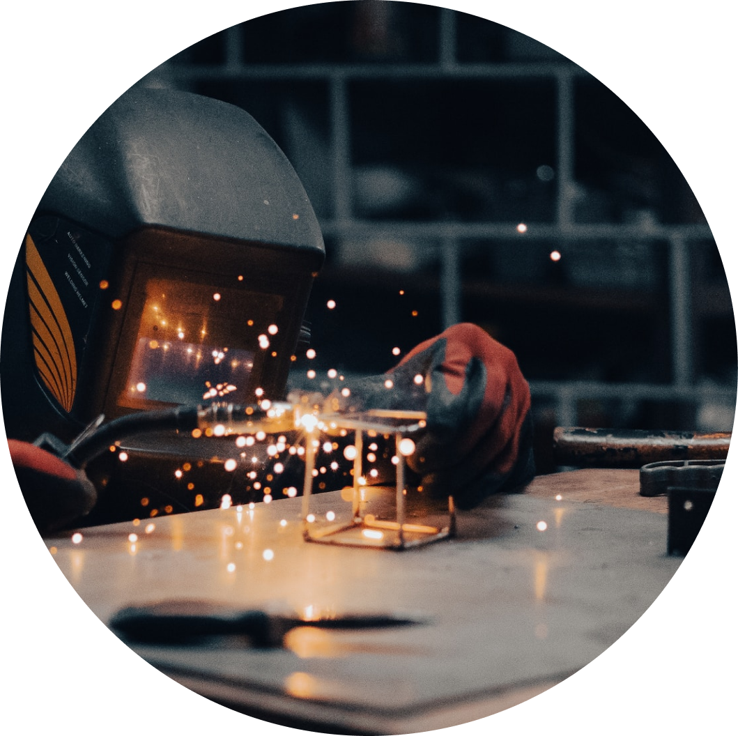 Image of a person soldering a wire cube