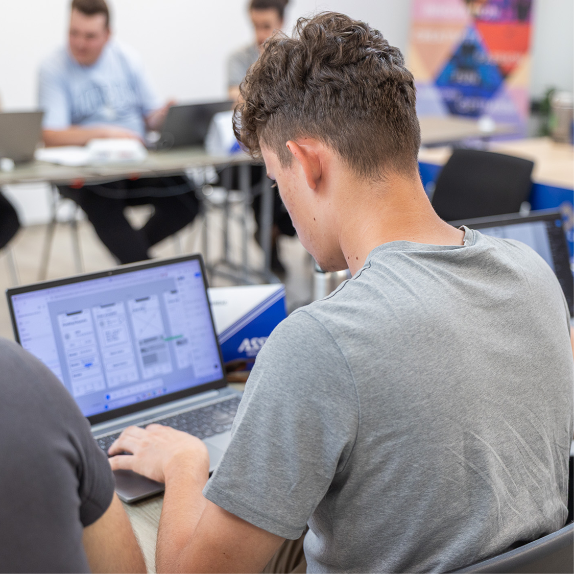 Student writing on laptop Image