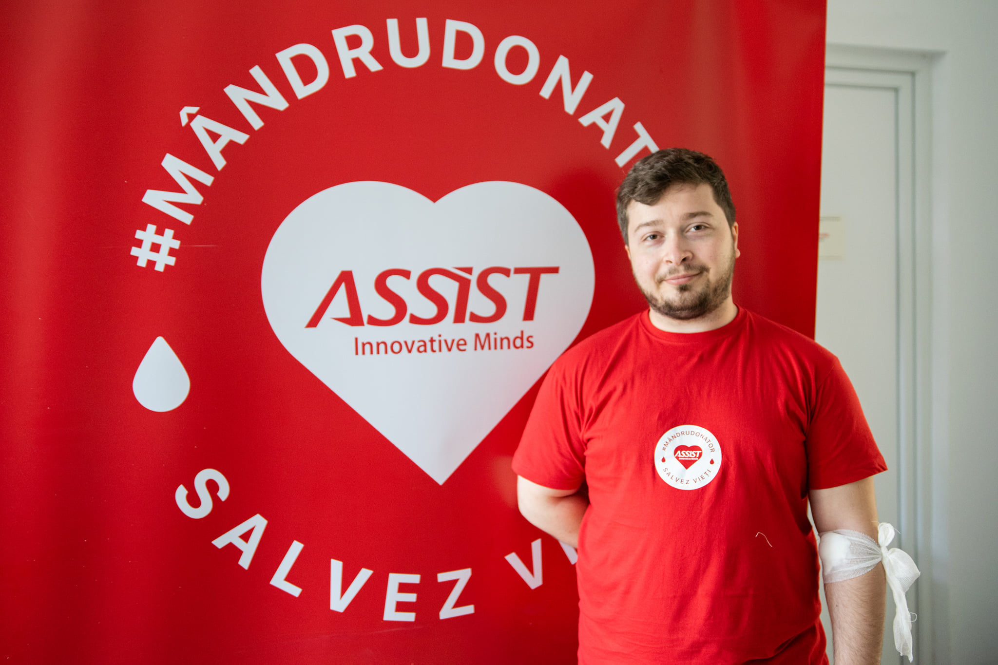 ASSIST Software logo, person standing
