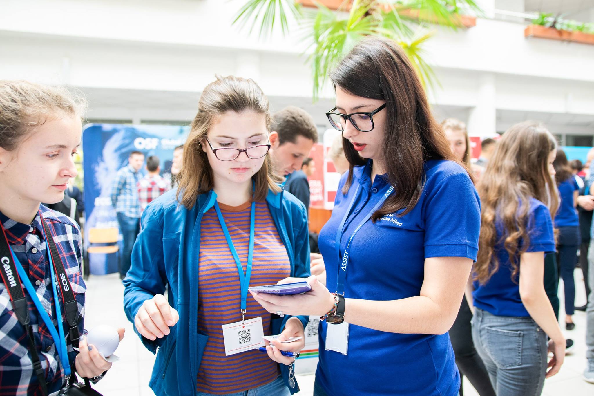 ASSIST Software employees talking with students at Codecamp Suceava event