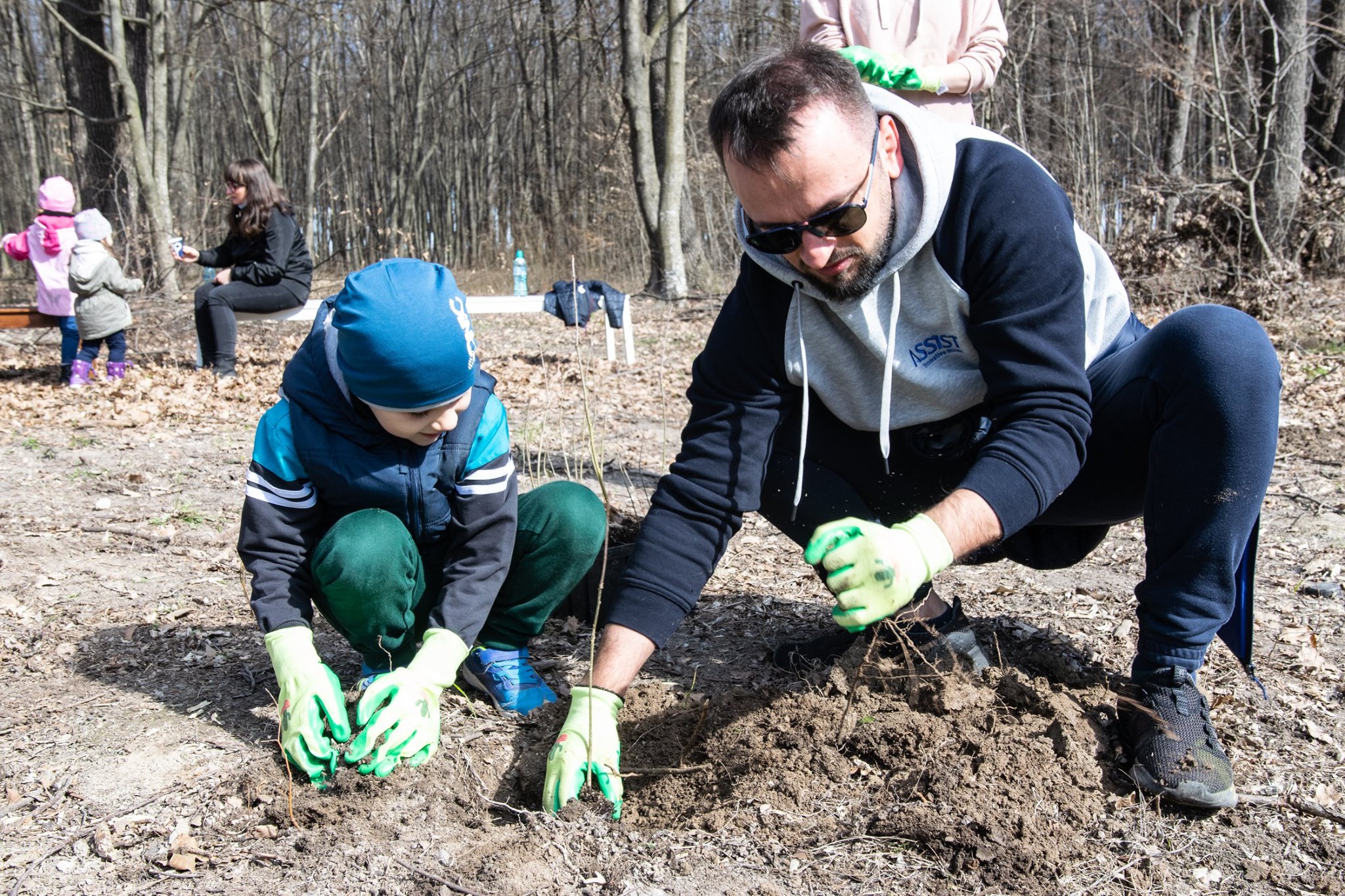 Our colleague and his son planting trees