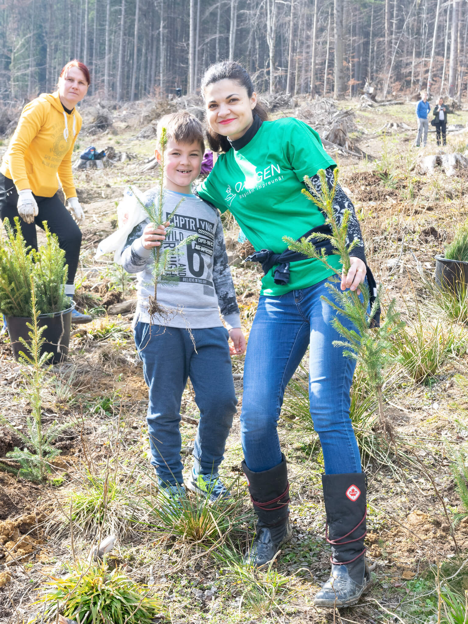 ASSIST Software volunteers planting trees in order to contribute to the reforestation efforts in the area.