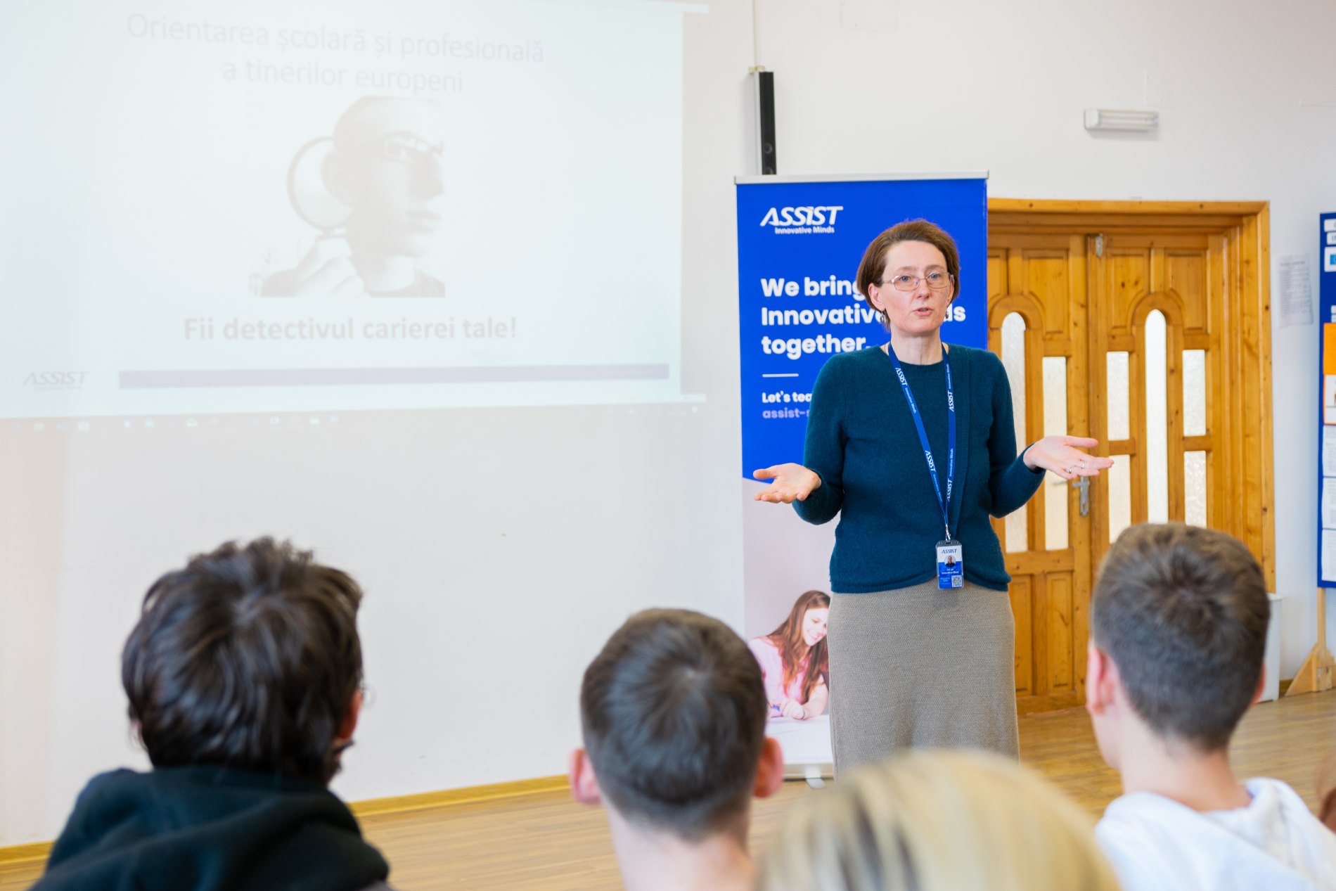 Magdalena Isan, HR Consultant at ASSIST Software talking with the students