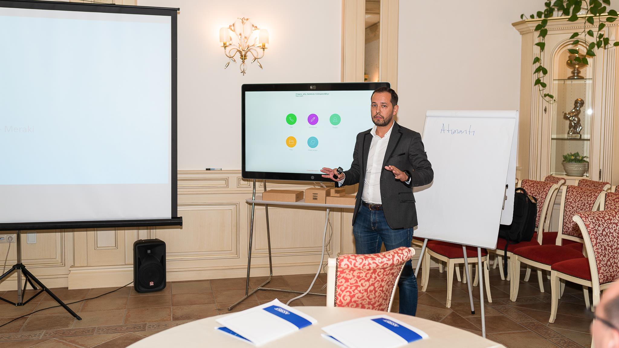 Cisco representative having a presentation in front of the guests at Connect Bucovina powered by CISCO and ASSIST Software