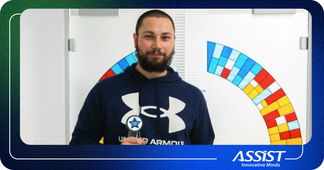 Ionut Holding the MVP award in ASSIST Software